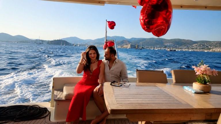 Planning an Unforgettable Proposal in Bodrum? +90 552 532 4848 Romantic luxury yacht proposal at sunset in Bodrum with elegant heart decorations, breathtaking sea views, professional photography, champagne, and a private experience designed to create the perfect engagement moment.